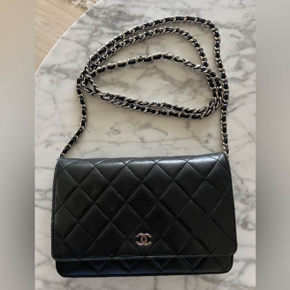 Authentic Chanel WOC lambskin-black